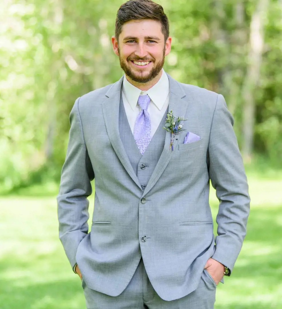 Photo of a male model wearing a tuxedo