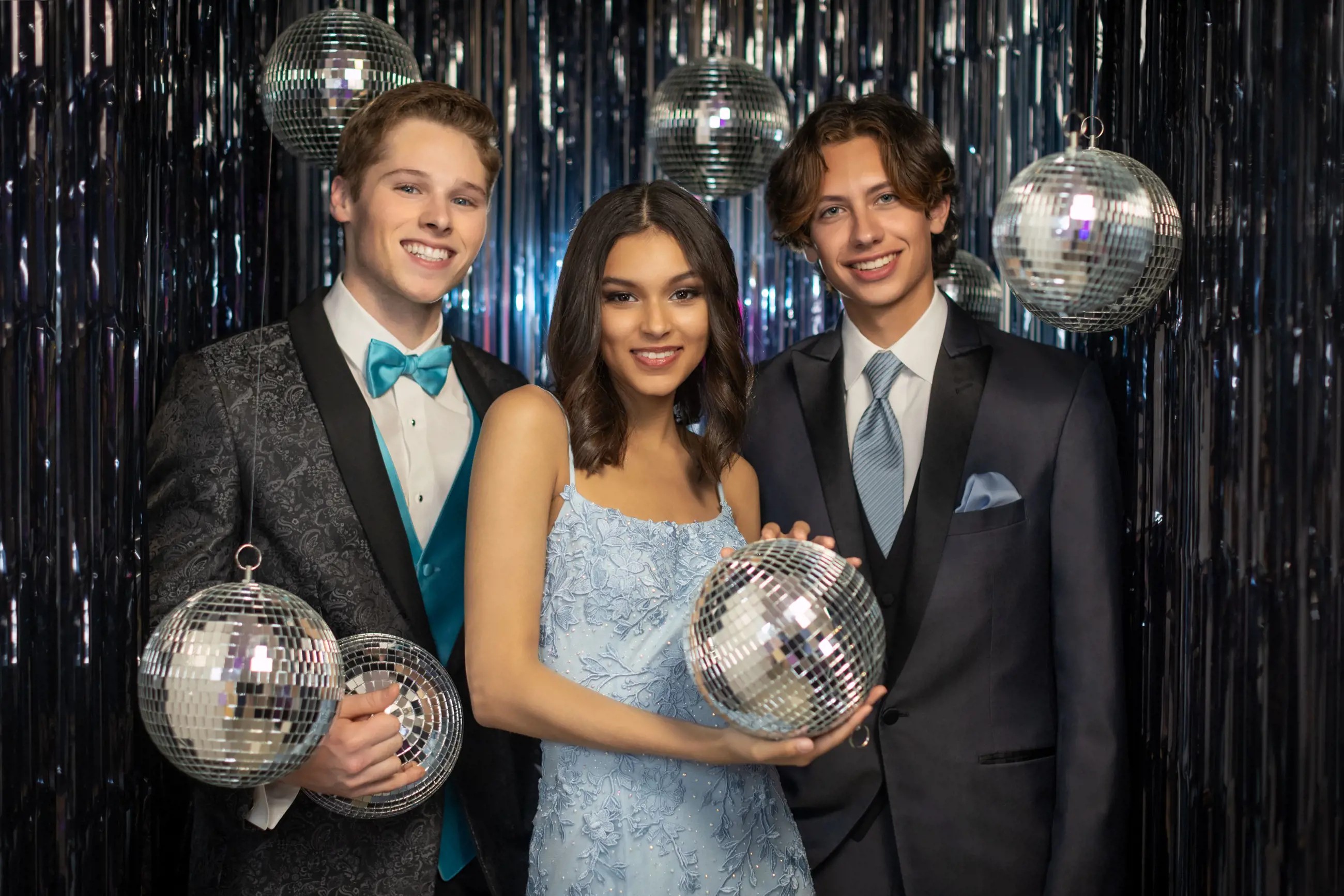 Сouple wearing a blue gown and a black suit