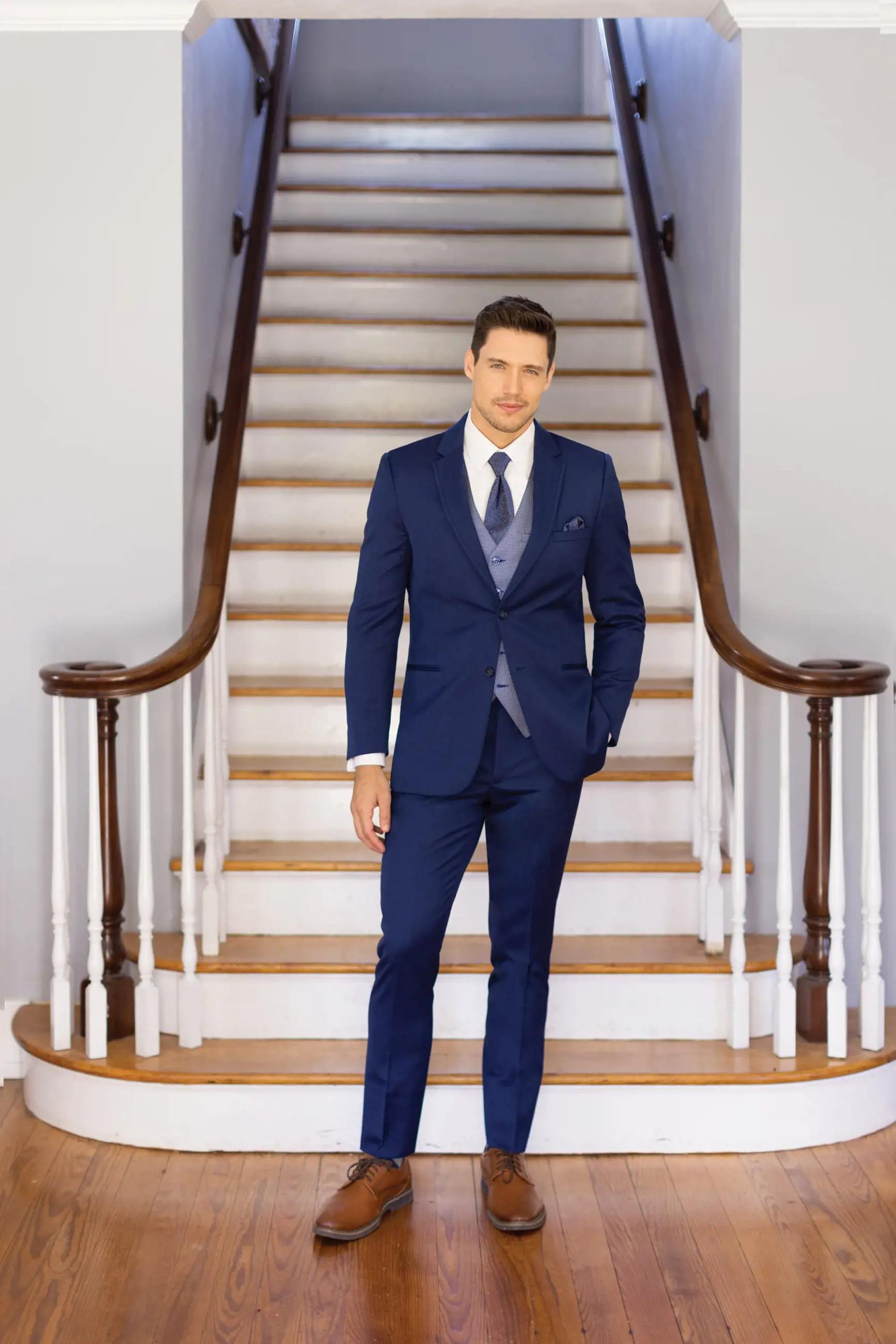 Model wearing a blue suit on the stairs