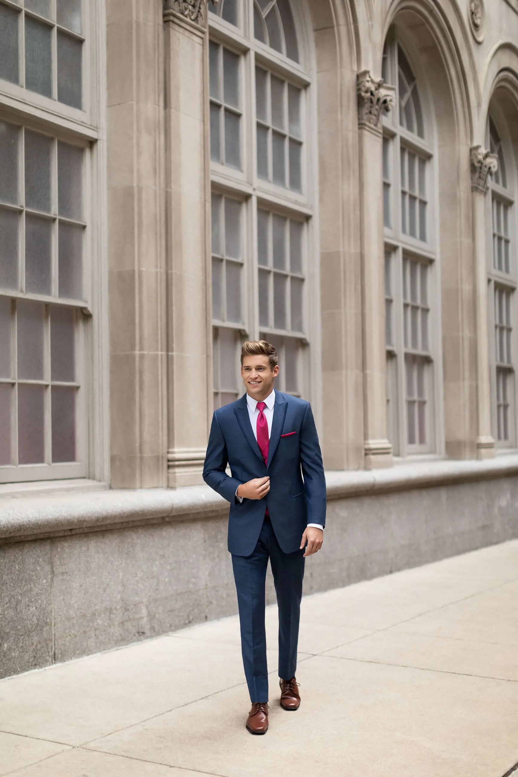 Model wearing a dark-blue suit at the street