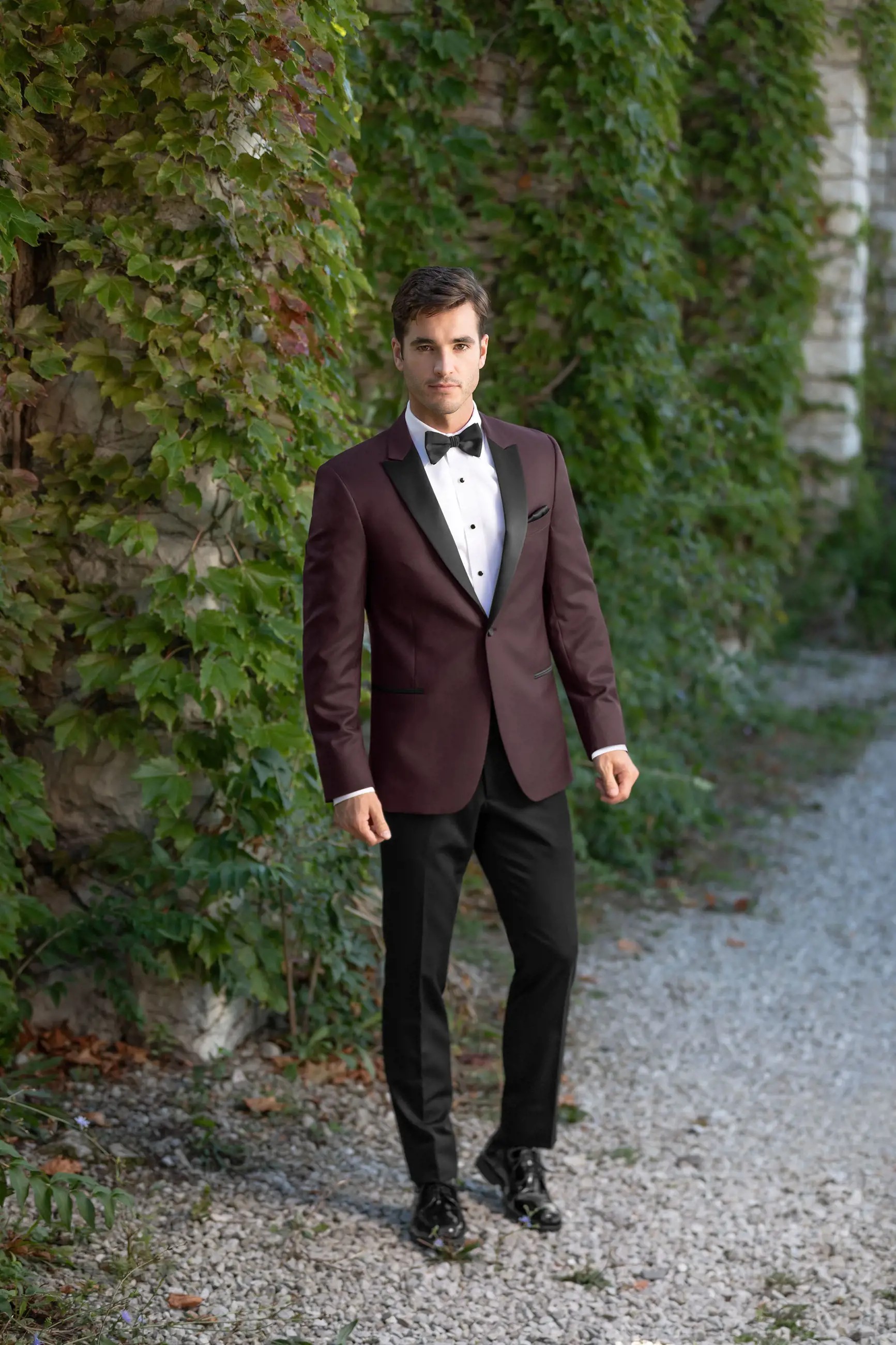 Model wearing a dark-red suit