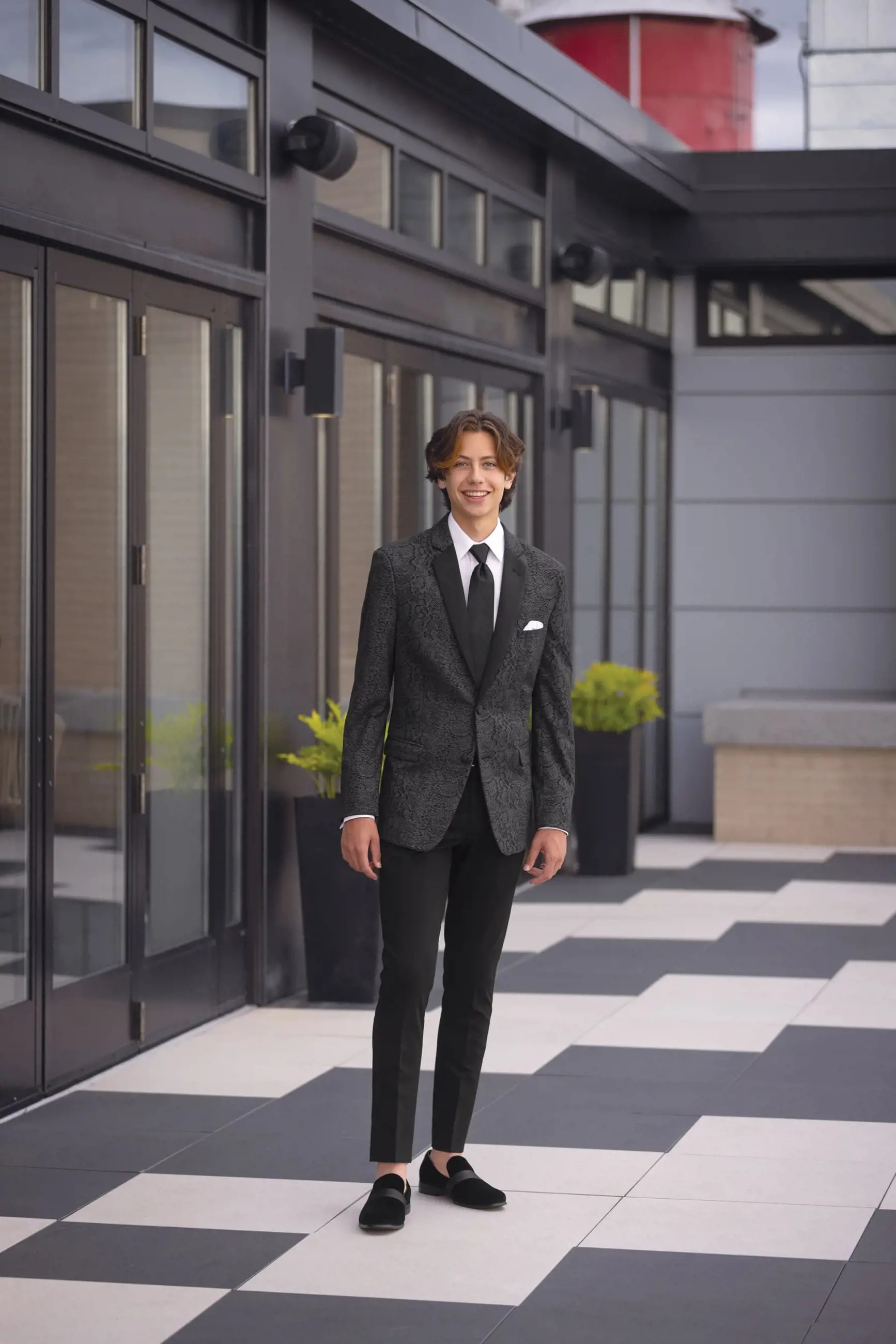 Model wearing a black suit