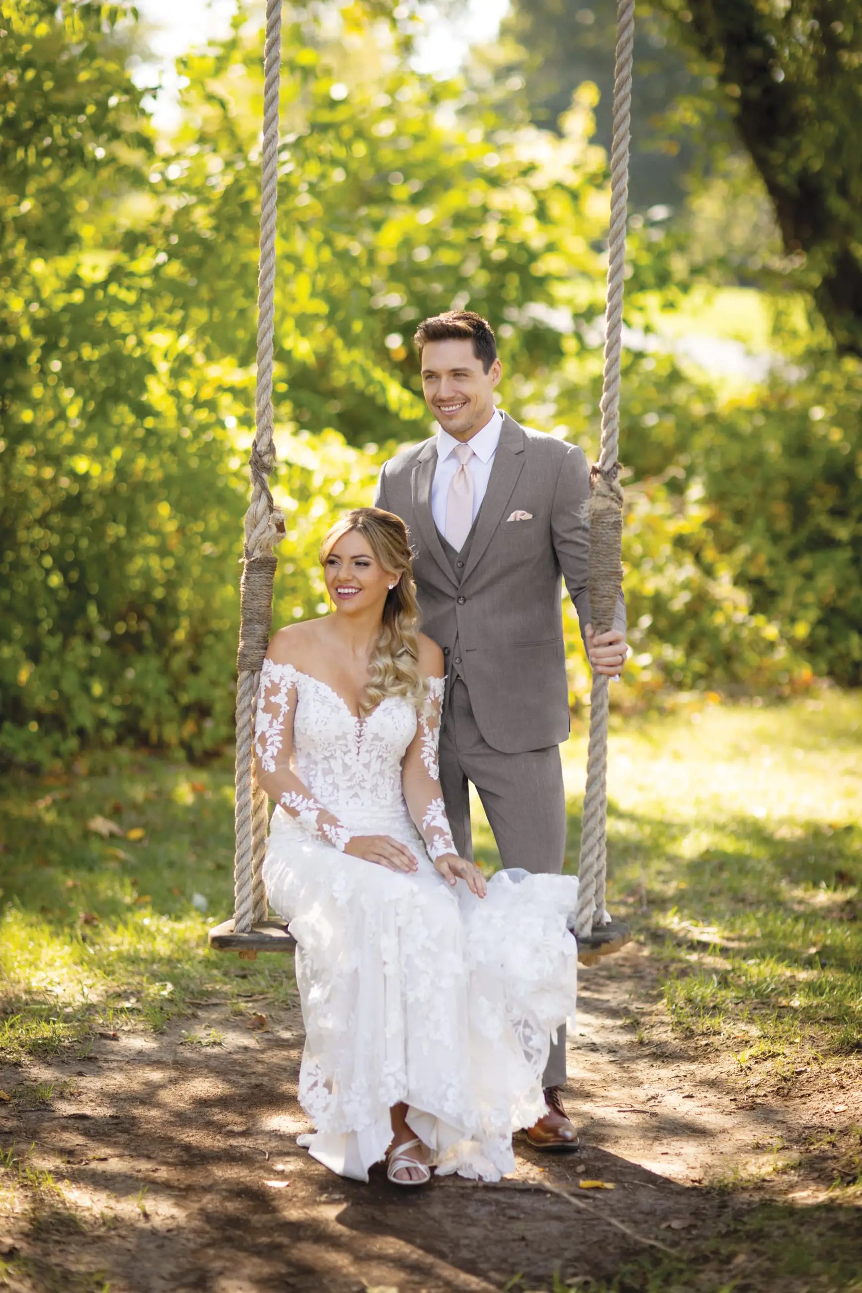 Сouple wearing a white gown and a gray suit