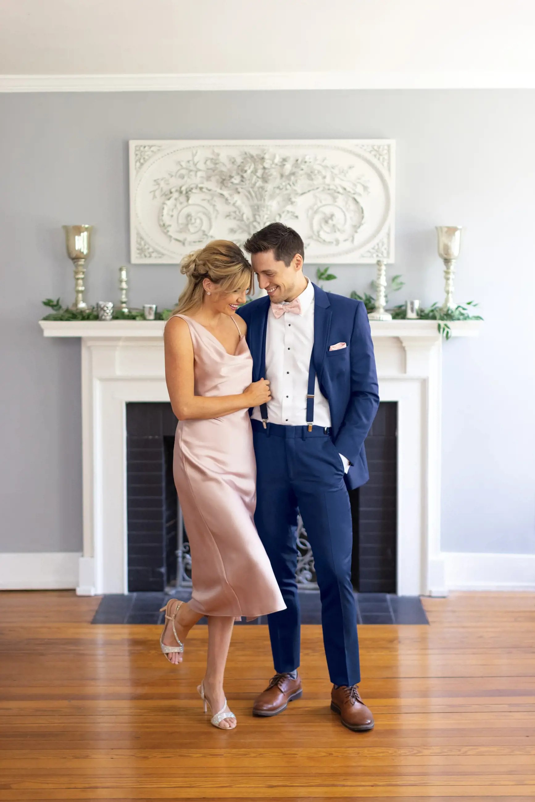 Сouple wearing a pink gown and a blue suit