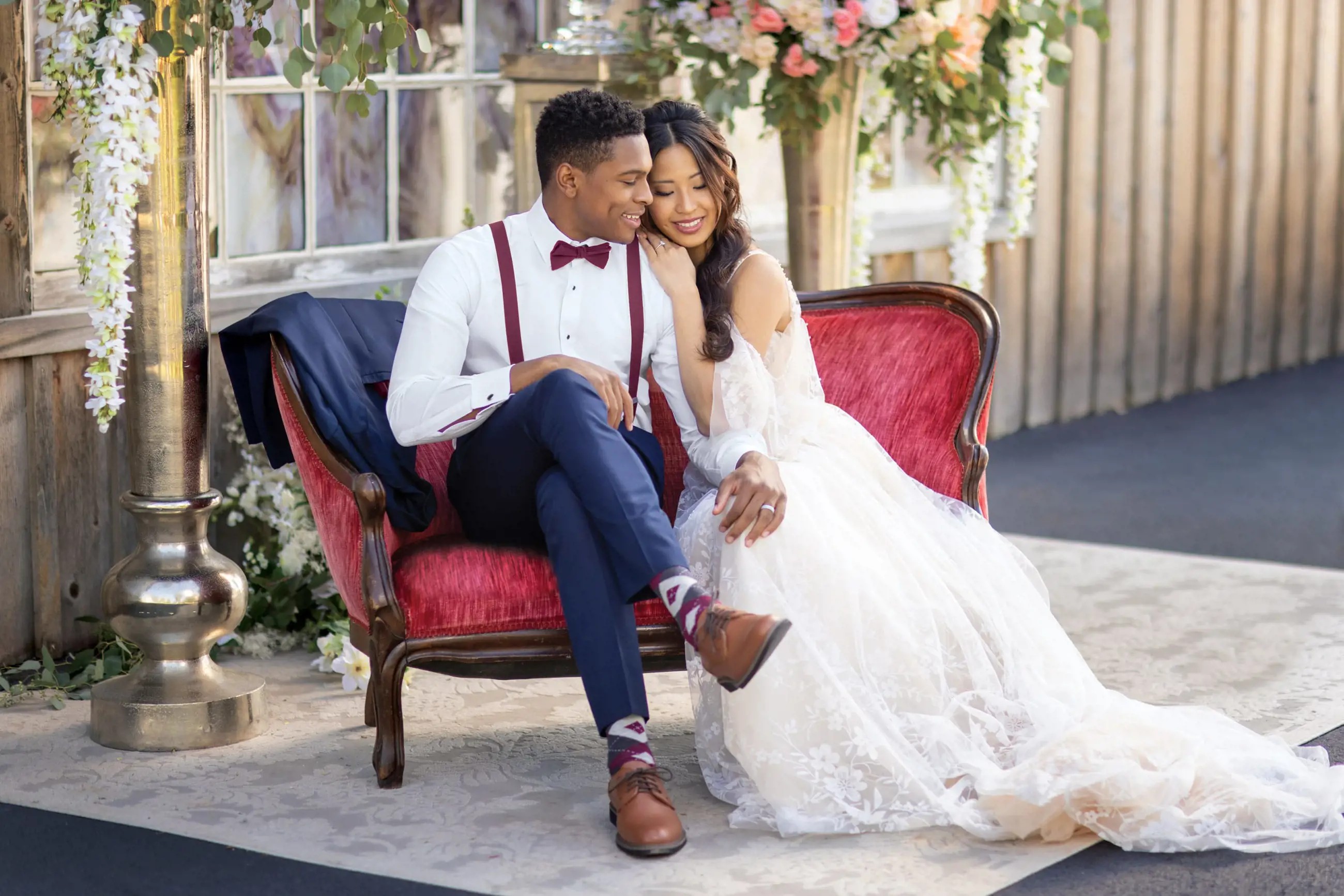 Сouple wearing a white gown and a black suit