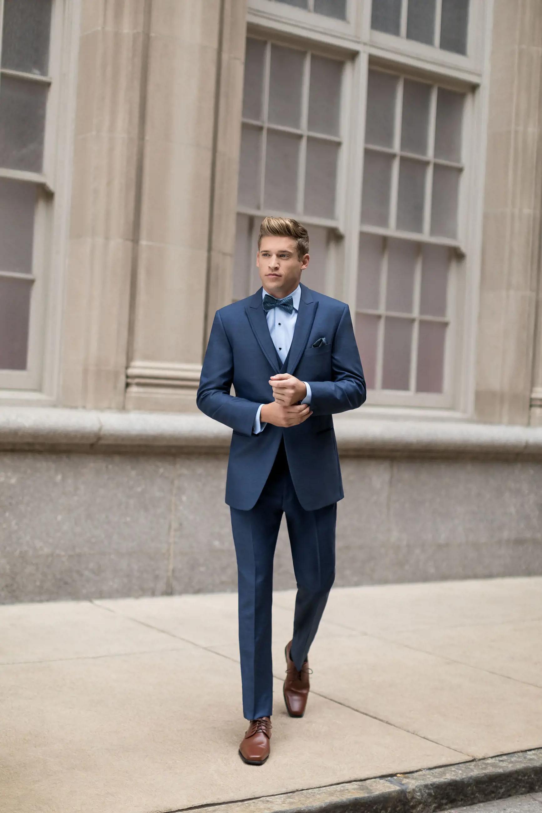 Model wearing a dark-blue suit at the street