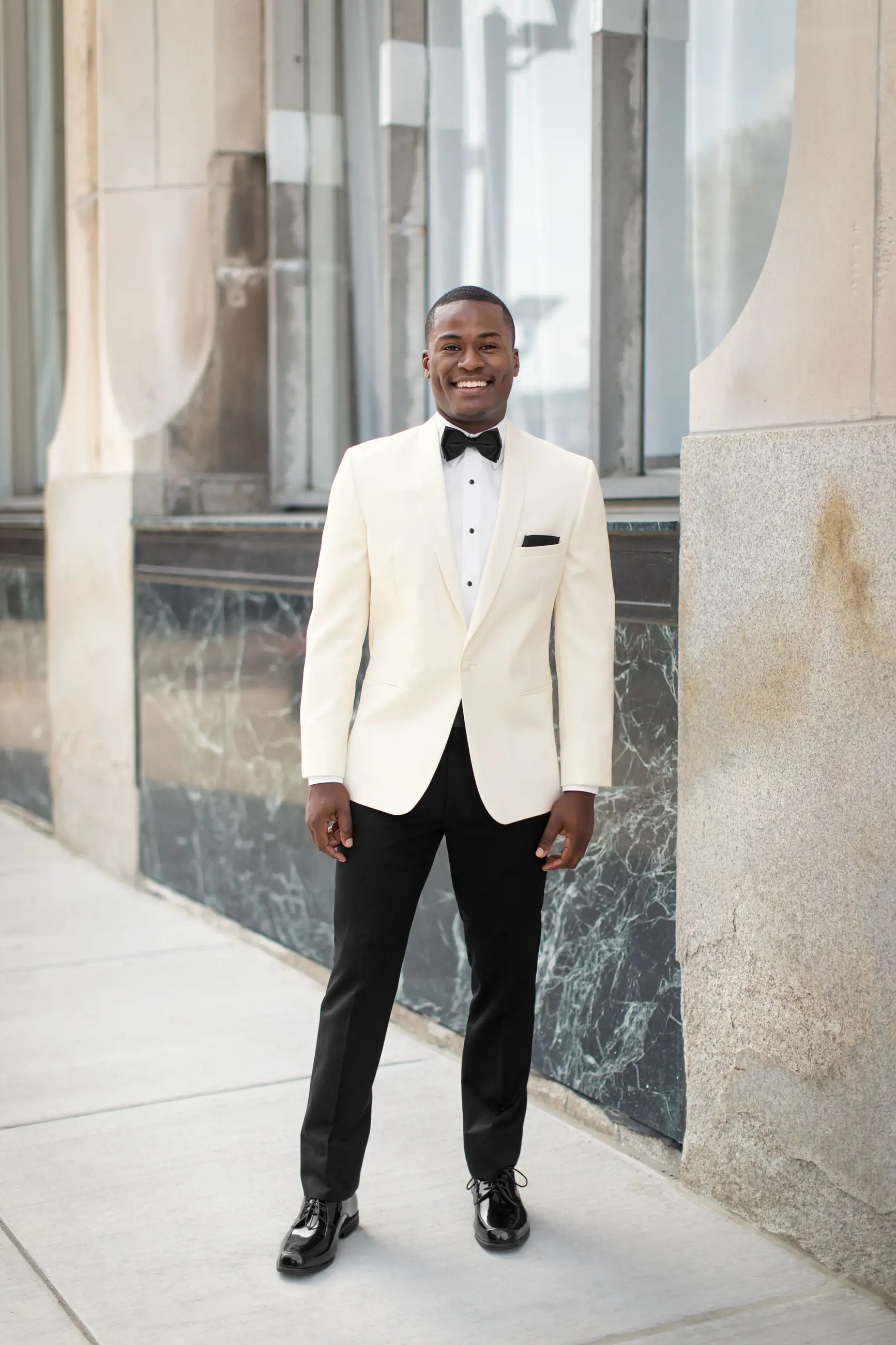 Model wearing a white suit