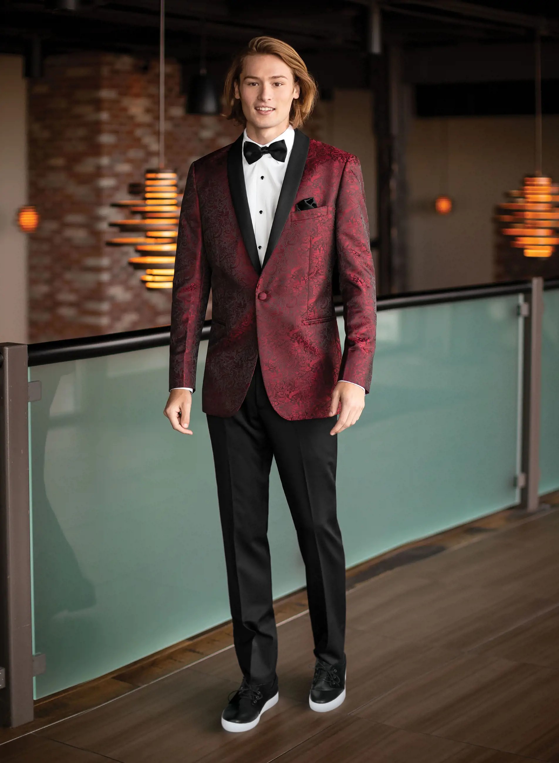 Model wearing a dark-red suit