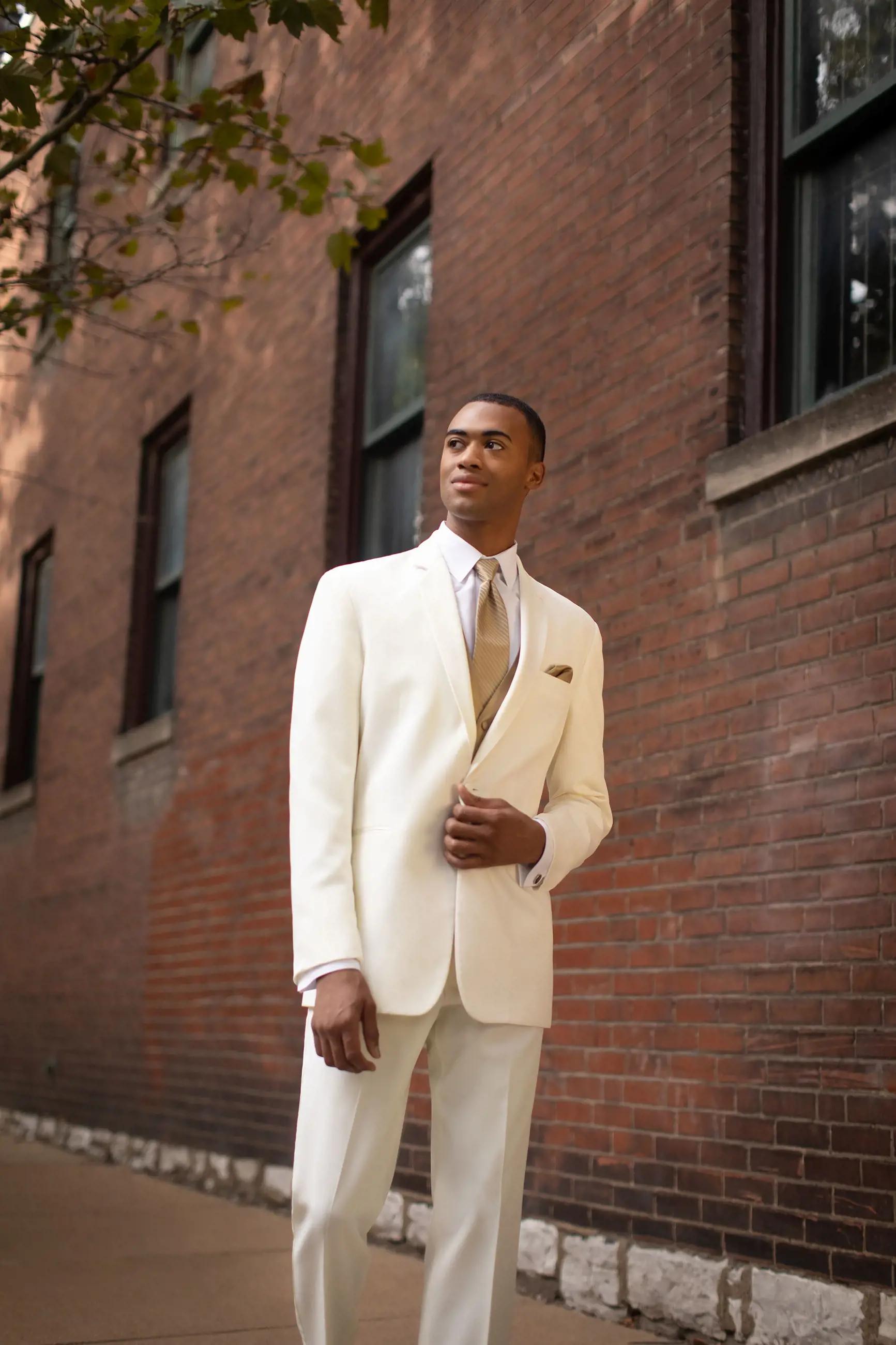 Model wearing a white suit at the street